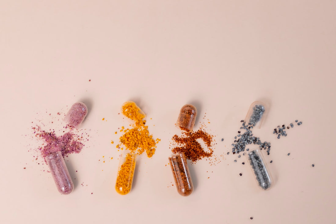 White supplement capsules on a clean surface representing NMN nicotinamide mononucleotide