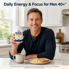 Man in his late 40s holding Soleu NAD+ for men 40+ in his kitchen at breakfast
